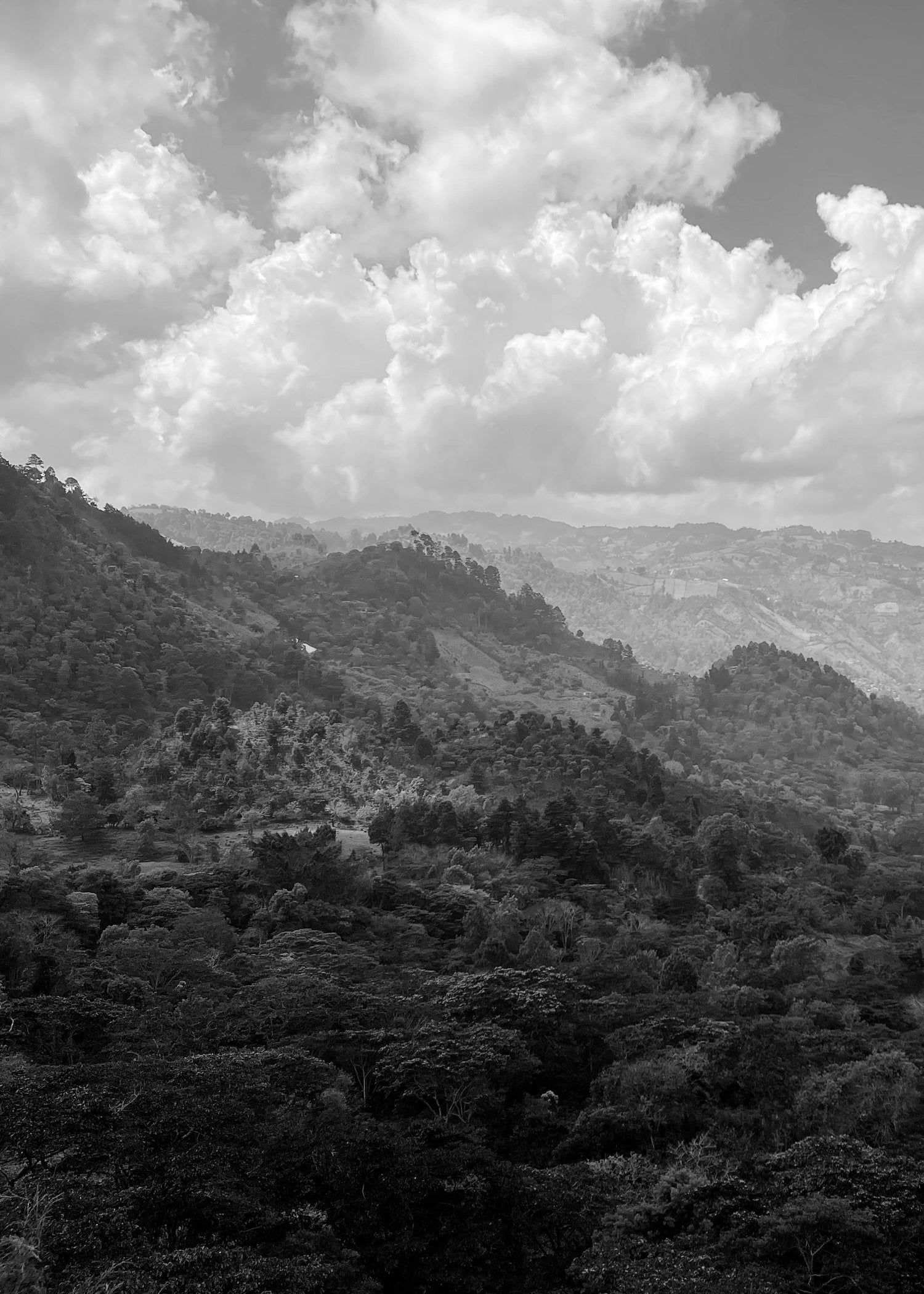 image of rolling mountain range and cloud filled sky