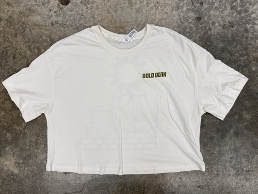 White t-shirt with 'bold bean' text on a textured surface