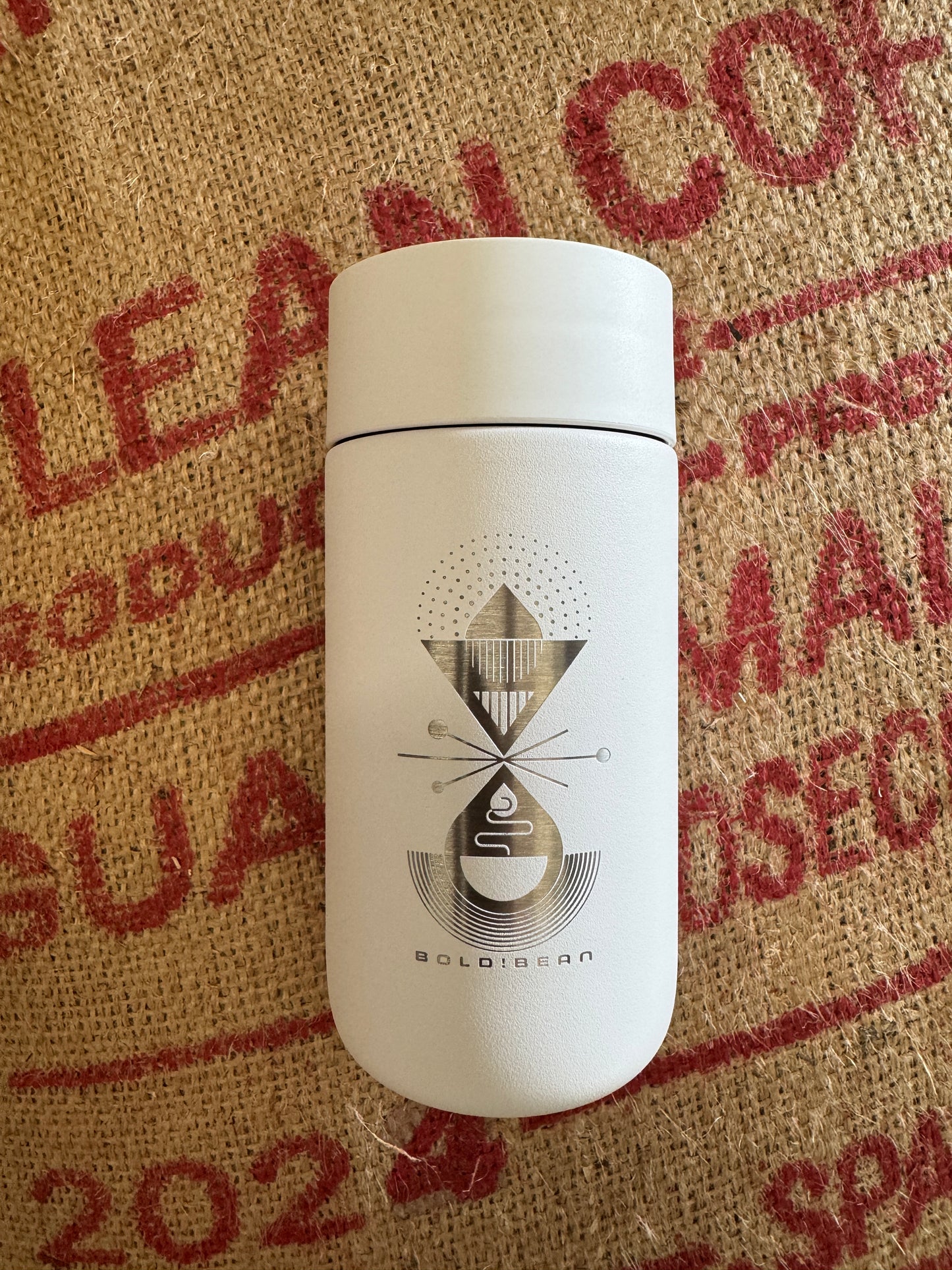 photo of white coffee travel much with logo 