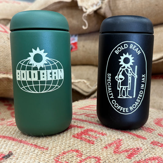 Two insulated coffee cups with 'Bold Bean' logo on a textured surface.