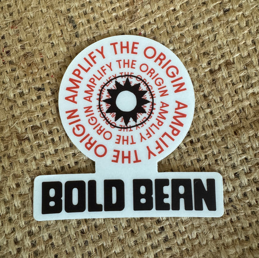 Round sticker with 'Amplify the Origin' text and 'Bold Bean' branding on a textured background
