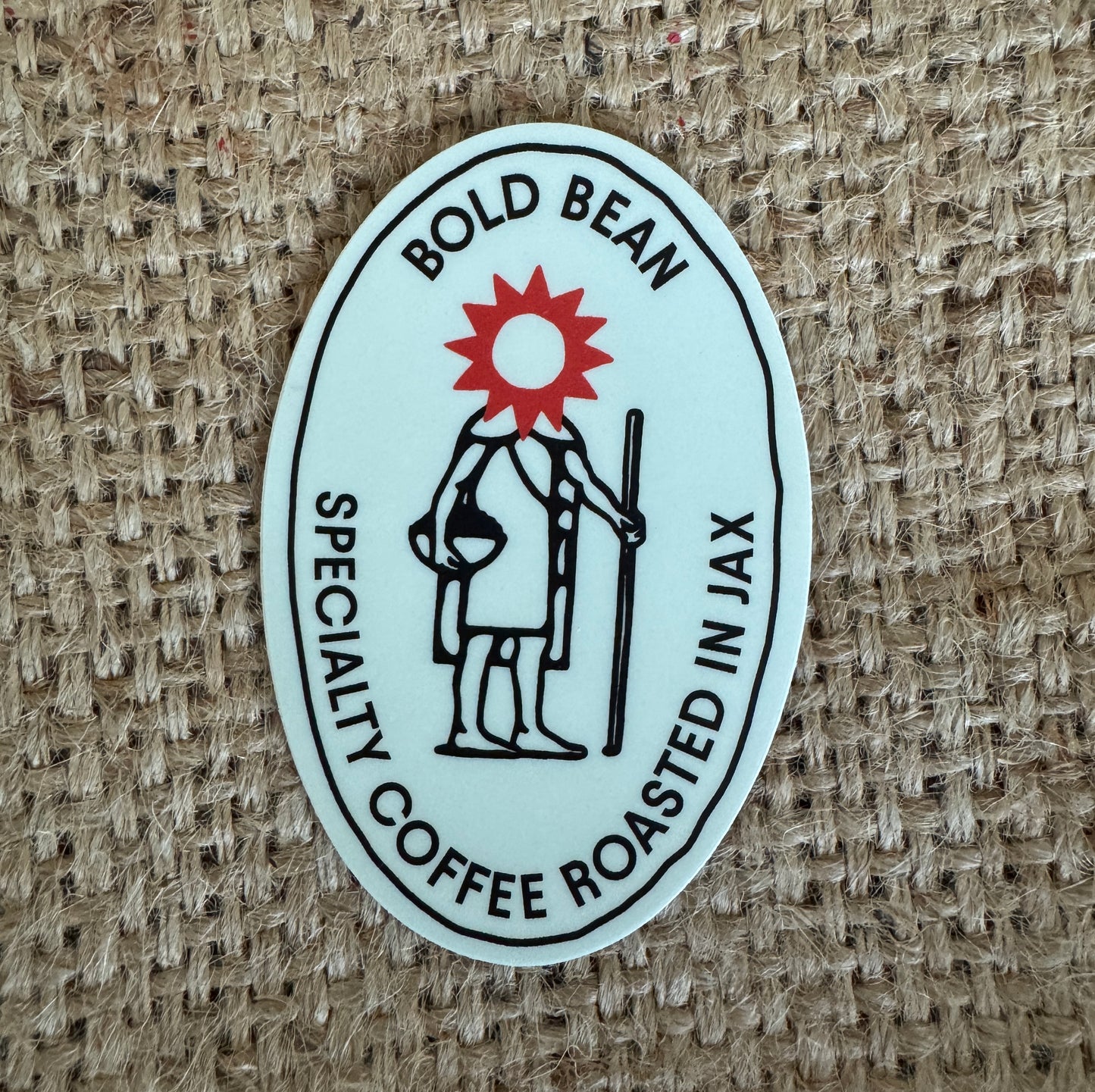 Sticker with 'Bold Bean' logo on a textured brown background
