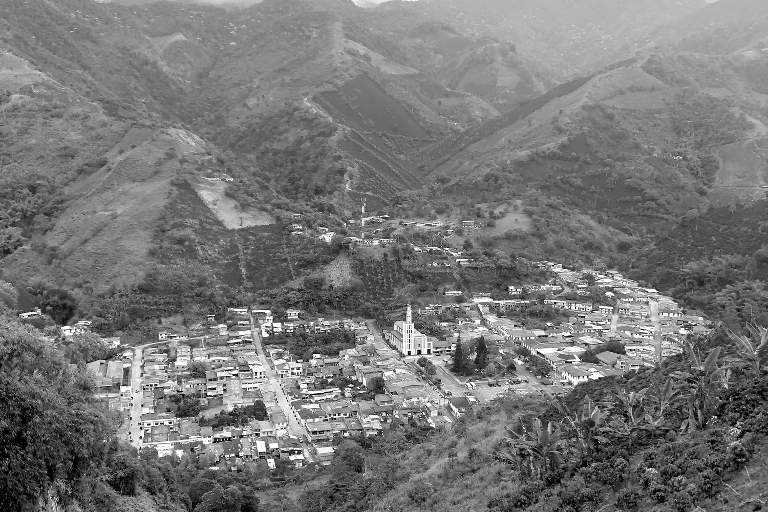 Black and white photo of La Celia town shot from mountains above