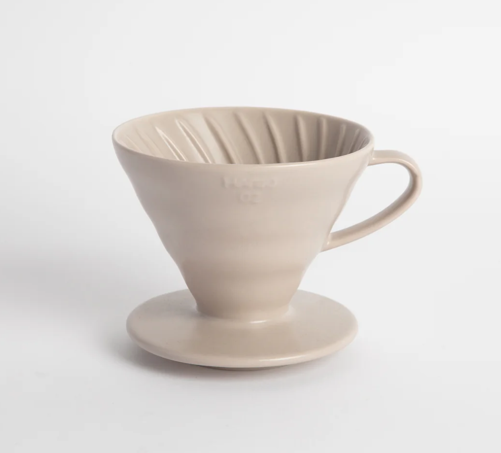 Beige ceramic coffee filter on a white background