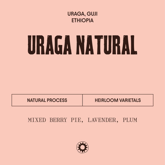 Uraga Natural coffee label with process and flavor description on a pink background